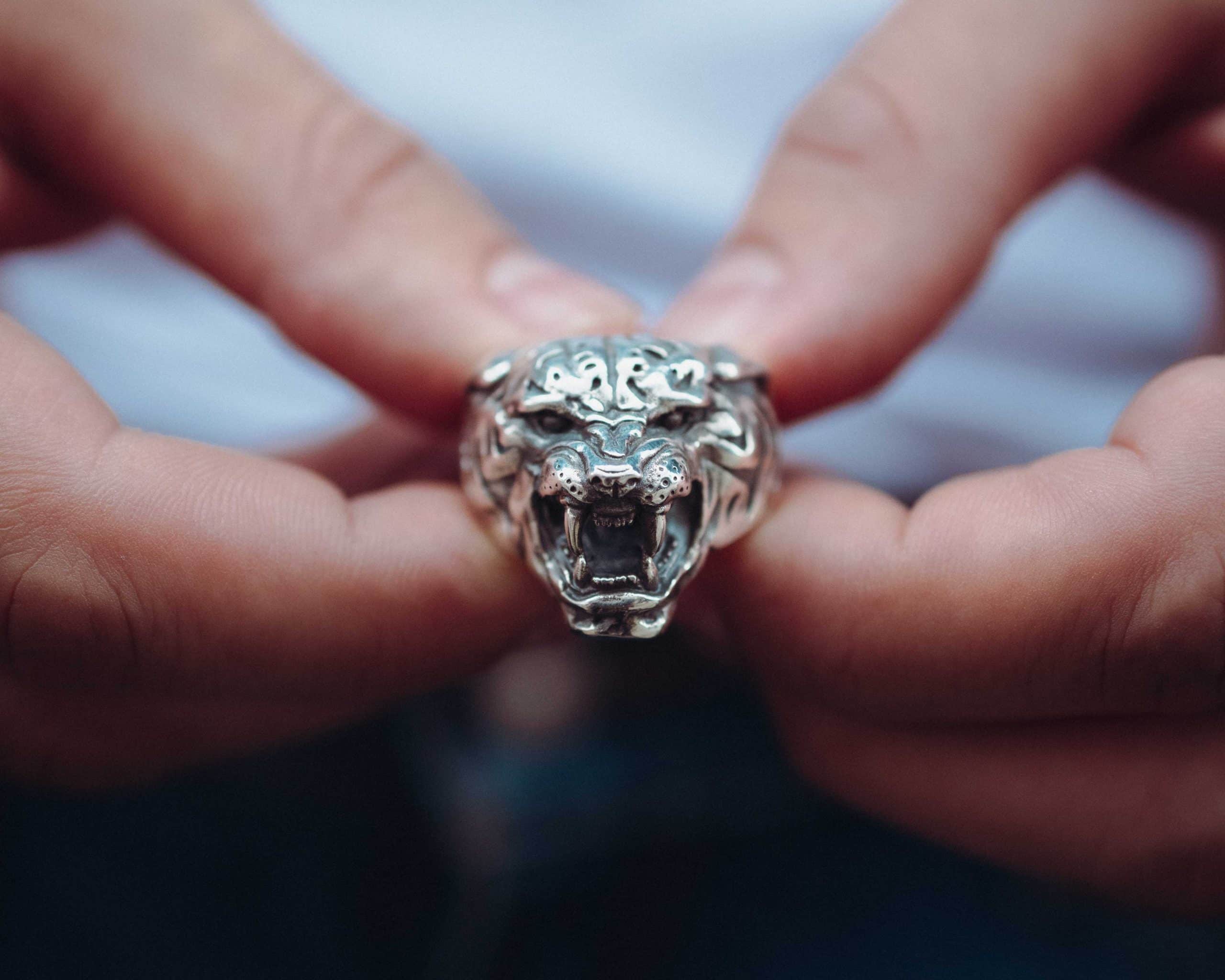 5. Gucci Tiger ring in gold with black and whit diamonds and emeralds - JFW  MAGAZINE